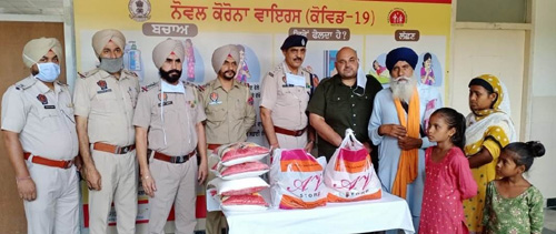 District police giving ration kits to the family of freedom fighters