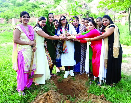 women planting trees
