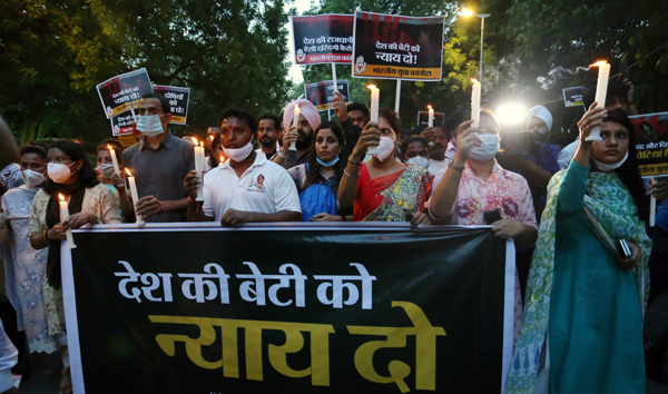 Indian Youth Congress activists during a candle march after a minor girl was allegedly raped and murdered,
