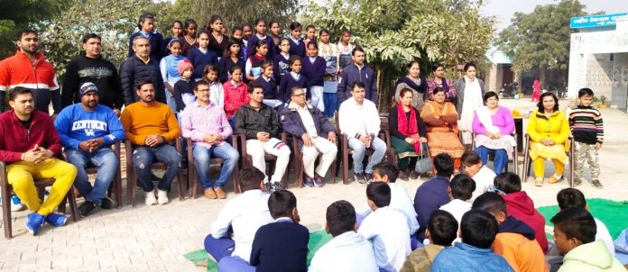 Distribute sweaters to Needy Children 