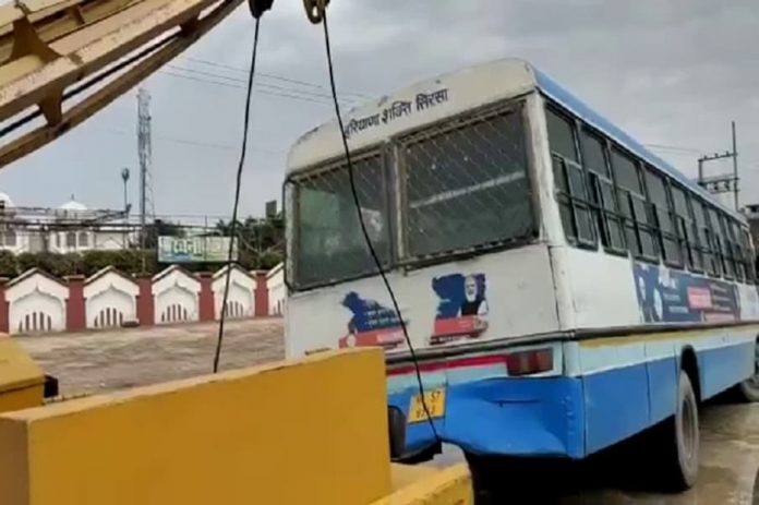 Two Roadways Buses Stuck in Potholes