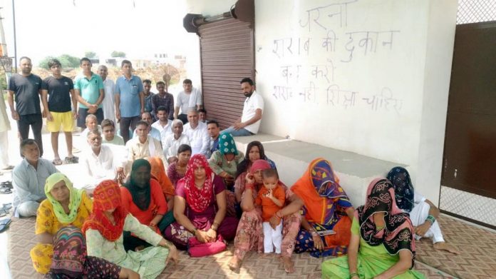 Women Sitting on Dharna to Remove Liquor Shops