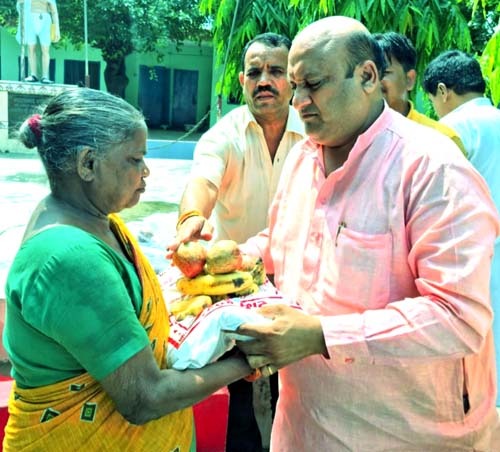 Social worker councilor distributed ration in leprosy ashram