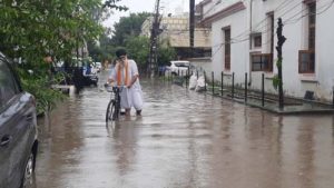 Water collects on the road due to rain