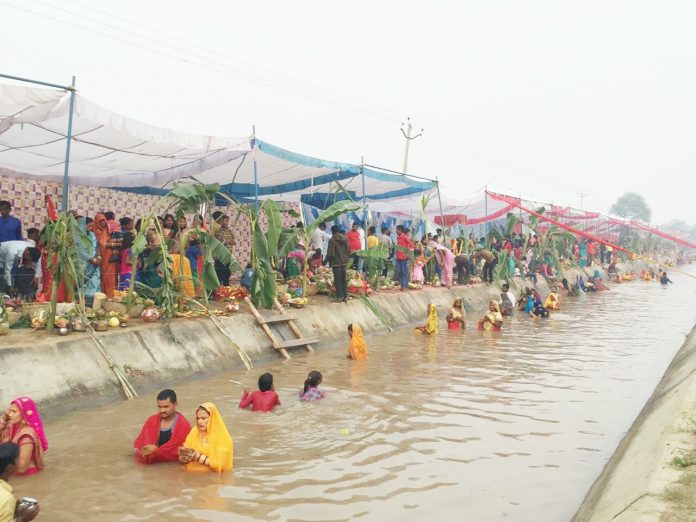 Migrants celebrated Chhath Puja at Nahari Ghat across the district