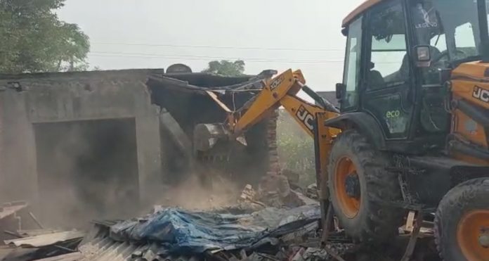 Police bulldozers run at drug smugglers house