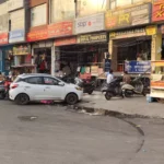 In Sigma City Chowk, hawkers and fast food stalls are set up in the parking space