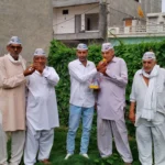 Celebrating the victory of Aam Aadmi Party in Gujarat and Punjab by-elections by distributing sweets