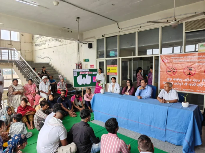 Officials giving information on International Day against Drug Abuse and Illicit Trafficking