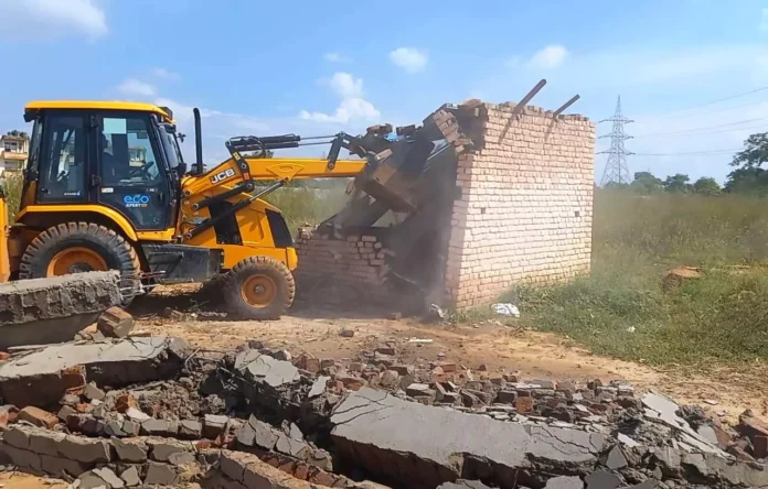 DTP ran a bulldozer on the construction of a colony being developed at three places in Dharuhera