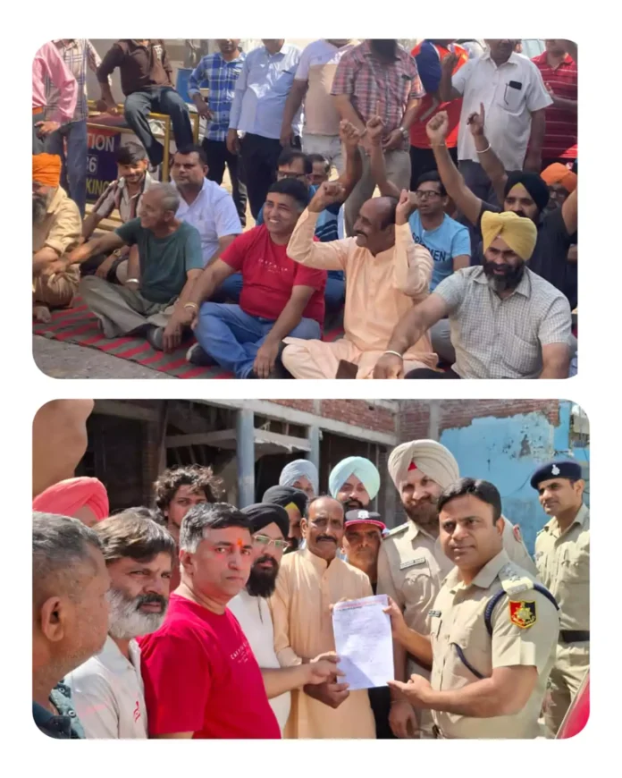 Shopkeepers hold protest demonstration demanding road construction.