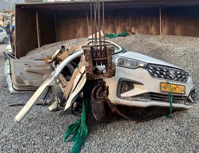 One killed and two injured as gravel-laden trailer overturns on car