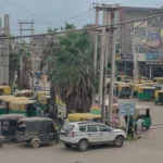 The 104-foot wide road is occupied in many places by mechanics and auto repair shops.