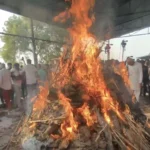The body of the ASI was cremated; his ten-year-old son lit the funeral pyre.