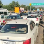 A two-kilometer-long traffic jam at the Chandigarh barrier, with strict police checking slowing down vehicle movement.