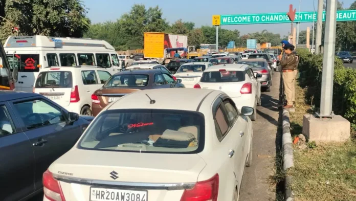 A two-kilometer-long traffic jam at the Chandigarh barrier, with strict police checking slowing down vehicle movement.