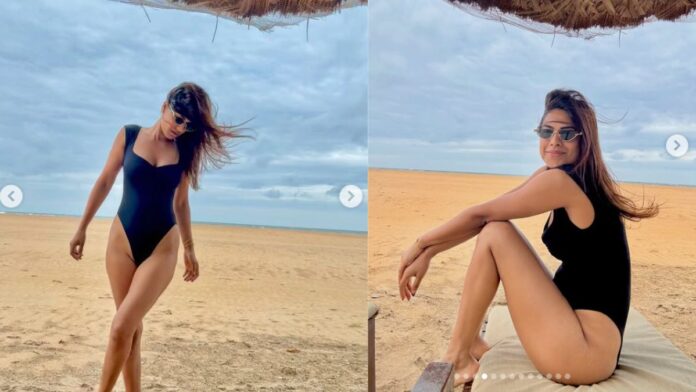 Nia Sharma New Photos: समंदर किनारे निया शर्मा का सिजलिंग अवतार, ब्लैक मोनोकिनी ने बढ़ाया पारा